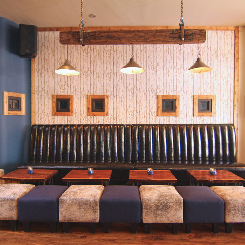 Southside’s banquette seating and warm wood interior.