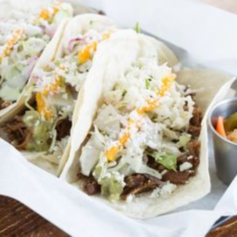 Southside’s carnitas tacos, plated to share.